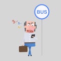 Man looking phone at bus stop