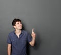 Man looking and pointing up to copy space Royalty Free Stock Photo