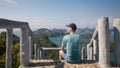 Man looking at sea with group tropical islands