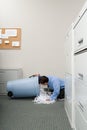 Man looking a shredded paper bin Royalty Free Stock Photo