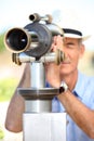Man looking through telescope Royalty Free Stock Photo