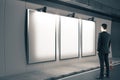 Man looking on three blank billboard Royalty Free Stock Photo