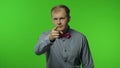 Man looking to camera and pointing finger to camera, choosing something positive awesome. Chroma key