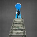 Man looking on top of money stairs with key hole Royalty Free Stock Photo