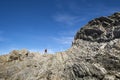 Man Looking for Trilobite Fossils During Low Tide in Green Point, Newfoundland #1 Royalty Free Stock Photo