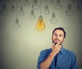 Man looking up with idea light bulb above head
