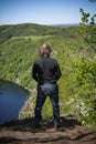 Man looking on view of Vltava river horseshoe shape meander from Maj viewpoint in Czech republic Royalty Free Stock Photo