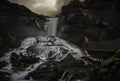 Man looking at a waterfall