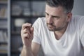 Man looking at wedding ring