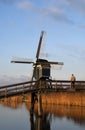 Man looking at windmill Royalty Free Stock Photo