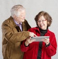 Man Looking at Woman's Tablet Royalty Free Stock Photo