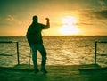 Man lookking over silent sea to horizon Royalty Free Stock Photo