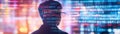 Man looks at binary code overlayed on an abstract multicolored background. Royalty Free Stock Photo