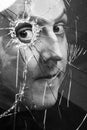 Man looks through broken glass. Black and white Royalty Free Stock Photo