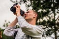 A man looks carefully through the monocular to the sky Royalty Free Stock Photo