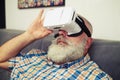 Man looks closely using modern VR headset glasses Royalty Free Stock Photo