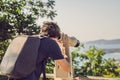 A man looks in Coin-operated binoculars at the sea Royalty Free Stock Photo