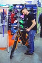 Man looks electric bike modern technology and environmental protection on the streets of the city sale