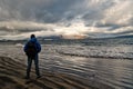 Man looks on horizon with reykjavik seascape in iceland. future goals concept. nature lovers. travelling and wanderlust