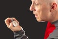 Man looks at a mechanical stopwatch in his hand. Time part precision. Measuring the speed interval with a watch