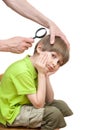 Man looks nits at the boy's head Royalty Free Stock Photo
