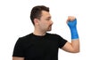 Man looks at plaster cast on white background Royalty Free Stock Photo