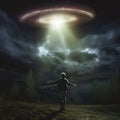 A man looks at a UFO in the sky. The man stretched out his hands and looks at the flying alien ship.