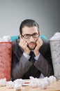 Man with lots of wasted paper Royalty Free Stock Photo