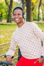 Young African American Man listening Music in Central Park, New