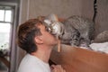 A man loves his cat, a cat responds to a person in return. Royalty Free Stock Photo