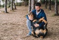 Man lovingly playing with his rottweiler dog Royalty Free Stock Photo