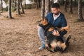 Man lovingly playing with his rottweiler dog Royalty Free Stock Photo