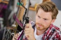 Man lubricating bike chain