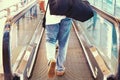 A man with luggage on a horizontal escalator Royalty Free Stock Photo