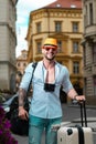 Man with luggage for vacation, trip. Man tourist with travel bag. Business man on business trip walking with travel bag Royalty Free Stock Photo