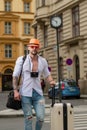 Man with luggage for vacation, trip. Man tourist with travel bag. Handsome young man on business trip walking with his Royalty Free Stock Photo