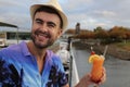 Man in luxury cruise drinking cocktail Royalty Free Stock Photo