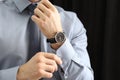 Man with luxury wrist watch on dark background, closeup Royalty Free Stock Photo