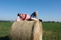 Man lying on bale of straw Royalty Free Stock Photo