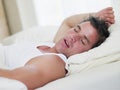 Man lying in bed sleeping Royalty Free Stock Photo