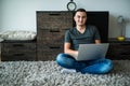man lying on carpet while using laptop Royalty Free Stock Photo