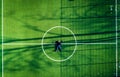 Man lying on the center of football field, top view Royalty Free Stock Photo