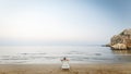 The man lying on a chaise lounge on the beach behind. man and sea Royalty Free Stock Photo