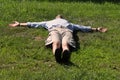Man lying down like a cross Royalty Free Stock Photo
