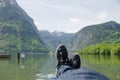 Man lying in front of a lake.