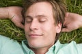 Man lying on grass sleeping