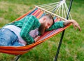 The man is lying on a hammock. Royalty Free Stock Photo