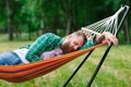 The man is lying on a hammock. Royalty Free Stock Photo