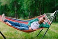 The man is lying on a hammock. Royalty Free Stock Photo
