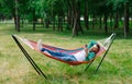 The man is lying on a hammock. Royalty Free Stock Photo